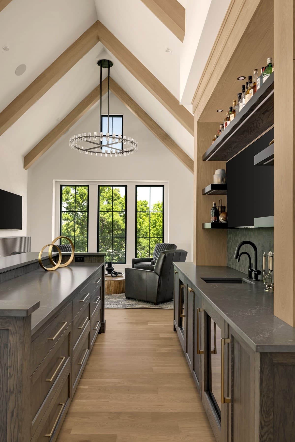 Vaulted bar lounge with integrated display and in-ceiling speakers