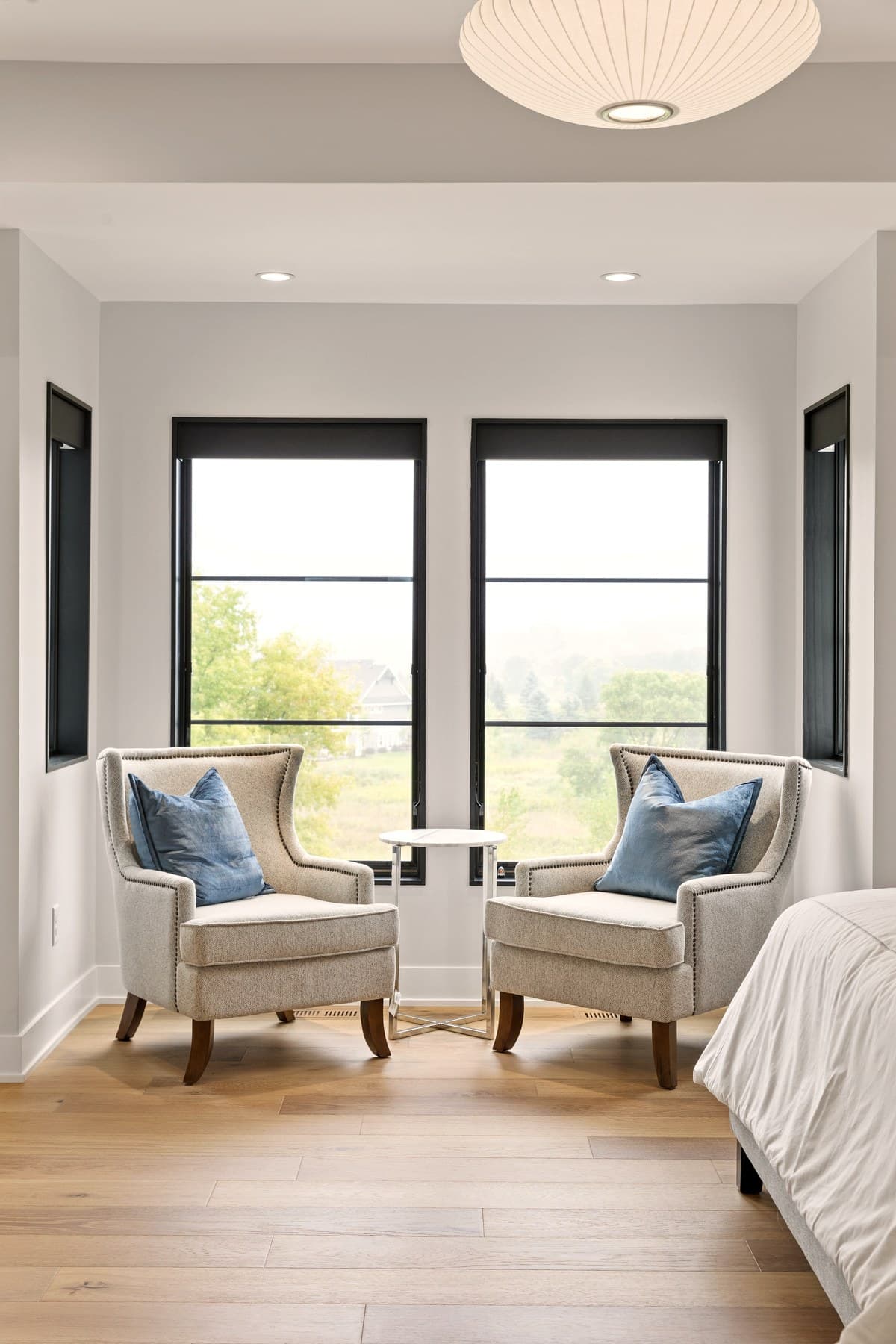 Master bedroom with expansive windows — motorized shade integration