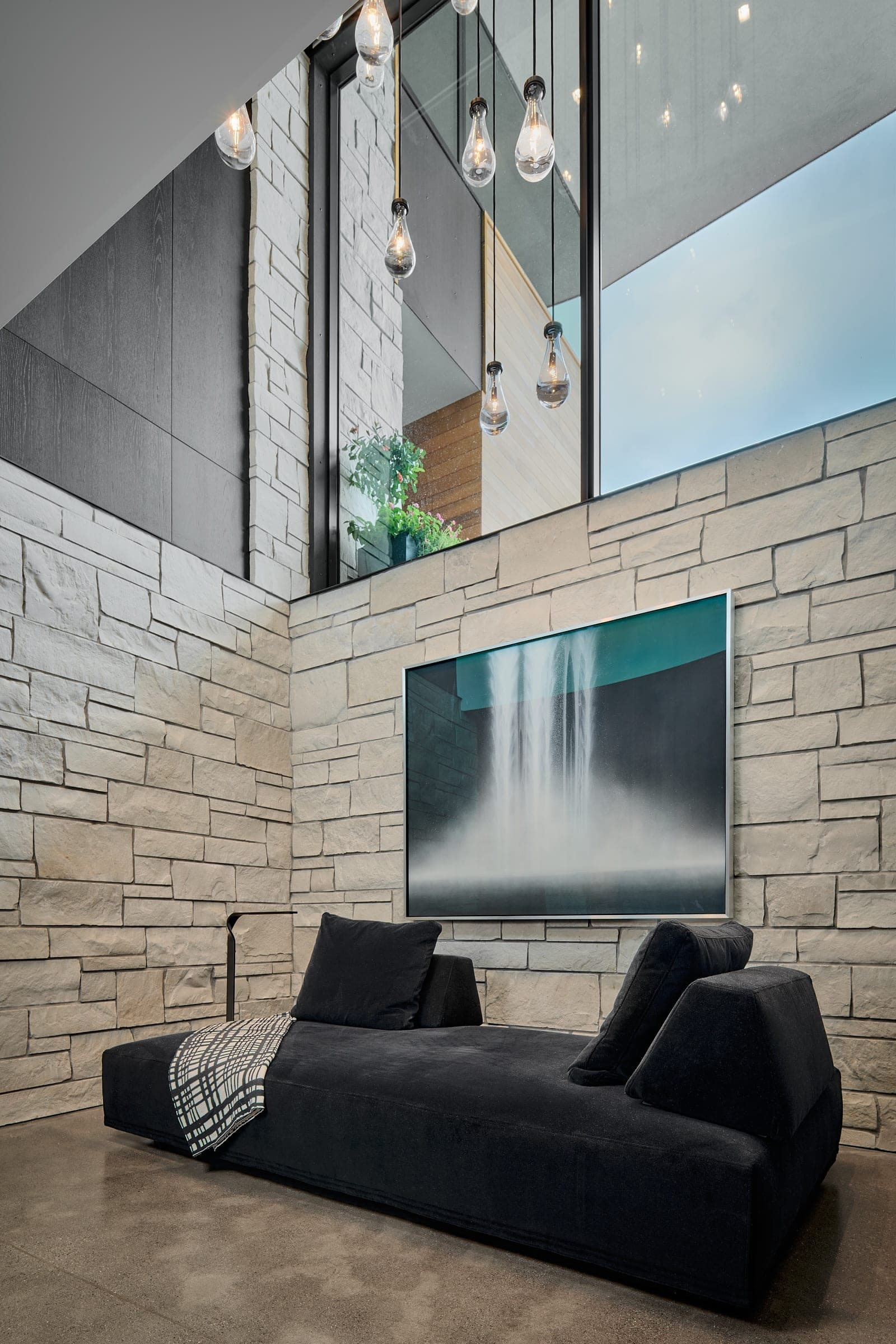 Framed waterfall photography illuminated by Ketra high-CRI lighting — luxury Minneapolis residence