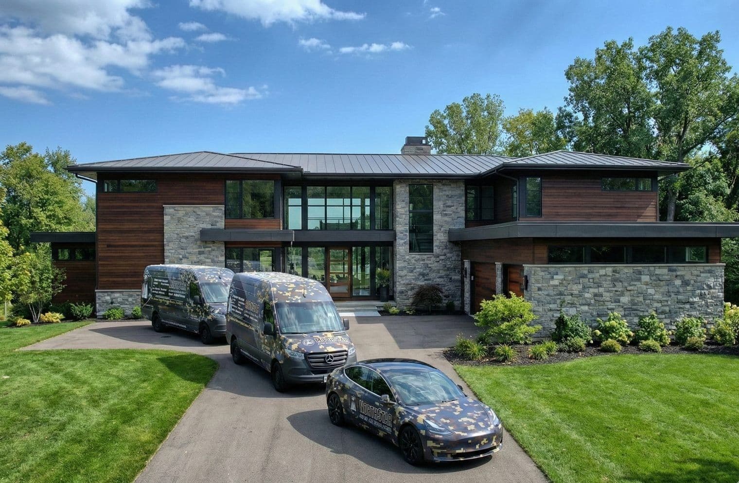 Contemporary stone and glass home with outdoor lighting systems
