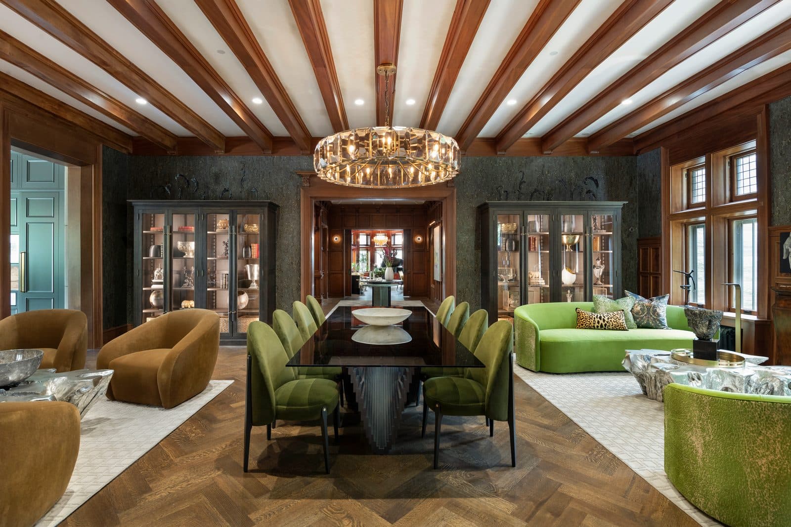 Grand formal dining room with exposed beam ceiling and custom millwork