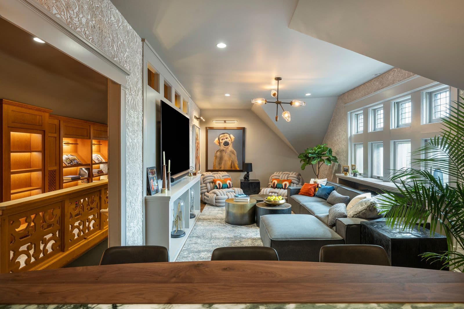 Loft living room with integrated smart display and LED lighting systems